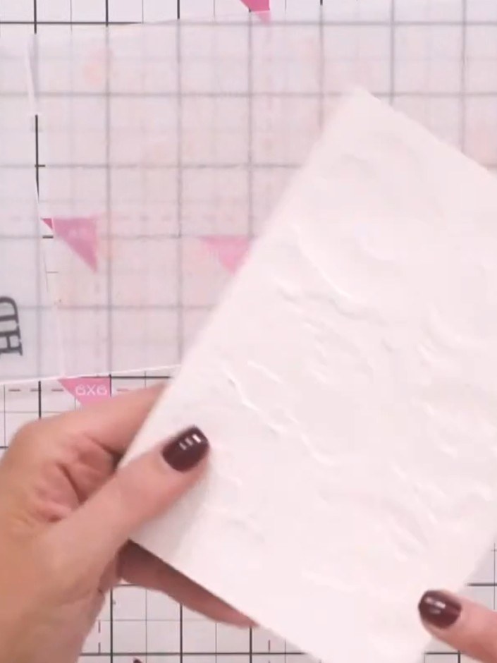 Step 1: Take your embossed design (with the watercoloured or inked flowers) and place it back into the embossing folde