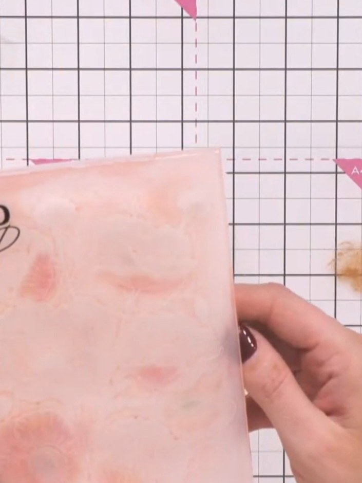 Step 4: Line the embossed cardstock back up carefully in the HD 3D embossing folder, ensuring it slots into place corr