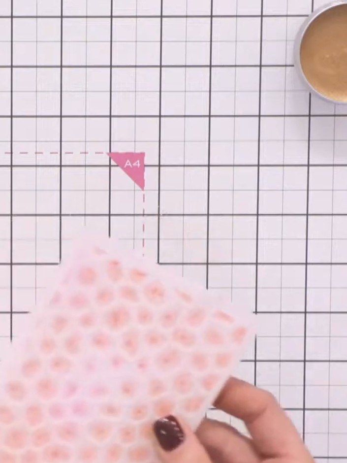 Step 4: Lightly spray water onto the inked embossing folder to create additional texture and variation in the ink cove