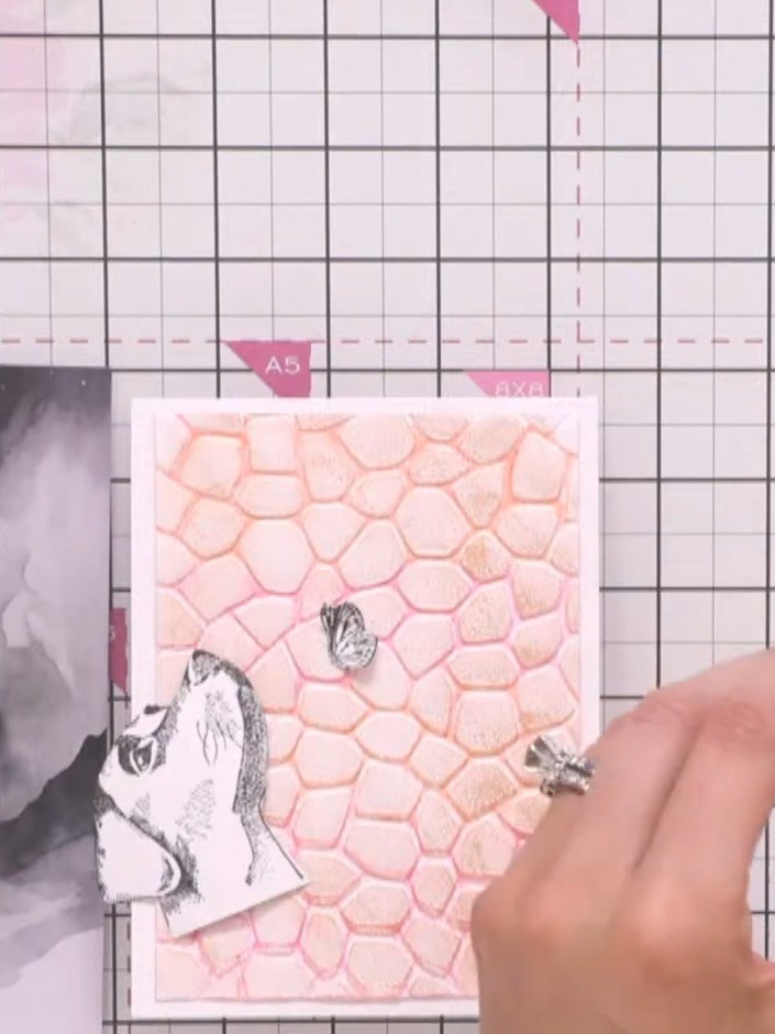 Step 9: Position the dog image onto the card front and adhere it in place, allowing it to stand slightly upright for a