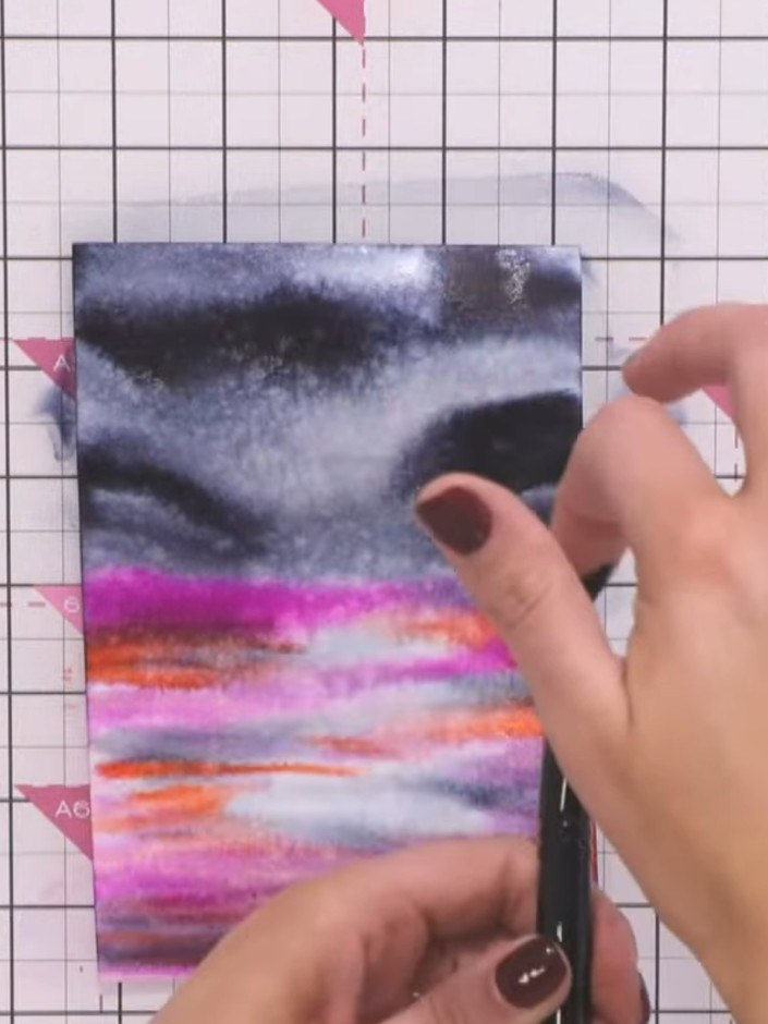 Step 7: Before the paper dries completely, use your wet brush to create a moon shape by twisting it in a circular moti