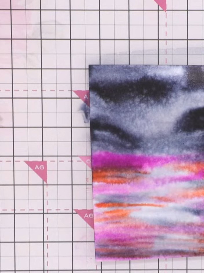 Step 8: Use a tissue to dab the moon area at the top of your watercolour panel. This will lift out some of the colour 