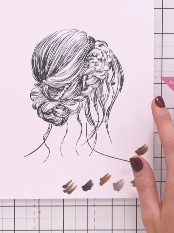 Step 4: Select the lightest brown marker shade. Apply colour to a section of the hair, starting with the halo area at 