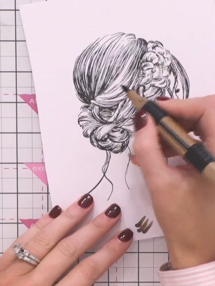 Step 5: Colour the hair following the lines of the stamp design with a lighter marker. Leave white paper showing aroun