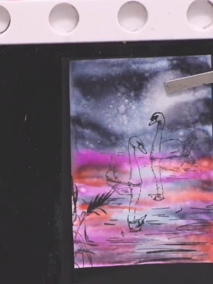 Step 12: Stamp the foliage elements in black ink along the bottom left corner and lower edges of the card to frame the 