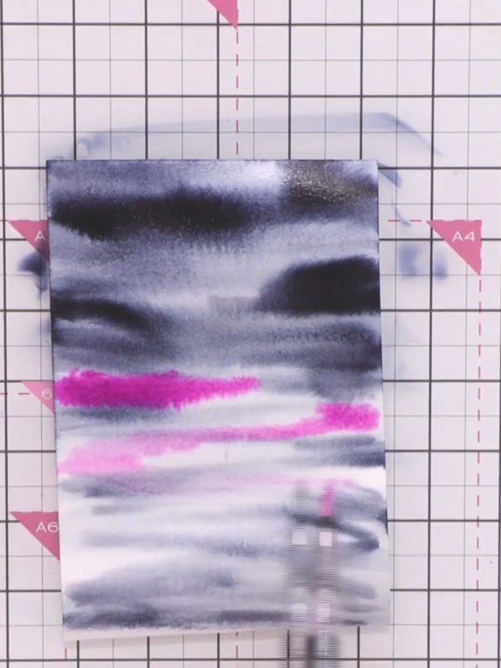 Step 3: Add purple ink by squeezing it directly from the water brush pen onto the wet paper where you want more intens