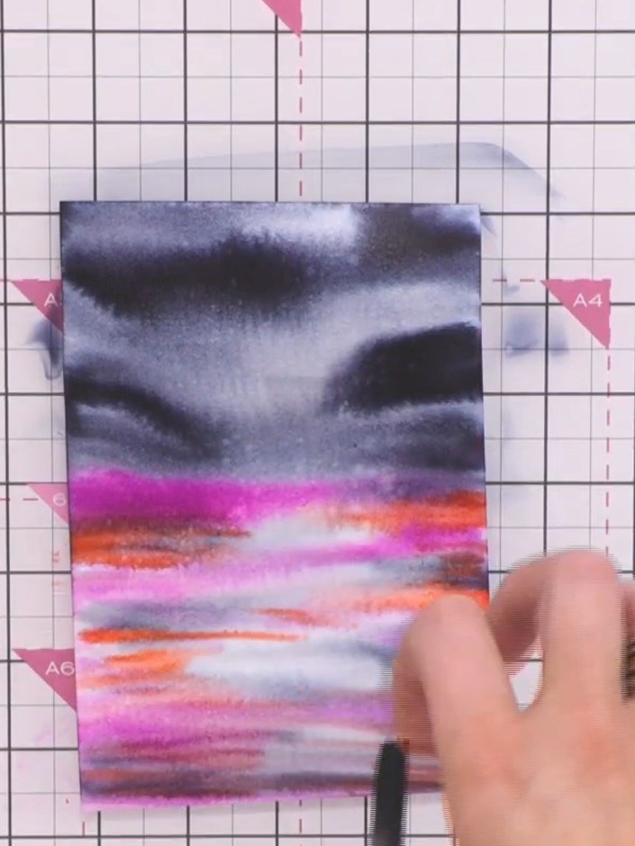 Step 5: Use a clean wet brush to gently move the colours around on the paper, creating a mottled, blended effect acros