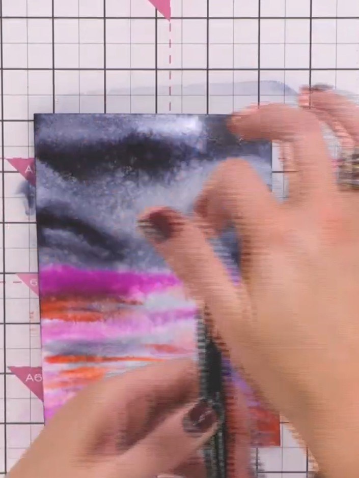 Step 6: Speed dry the watercoloured card with a heat gun before it is completely dry to set the colours and create the
