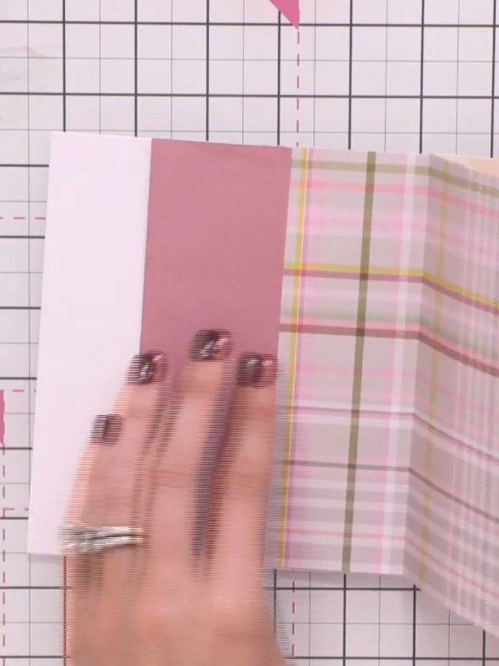 Step 10: Adhere patterned paper pieces to the plain side panels of each page. Layer the papers to create decorative sta