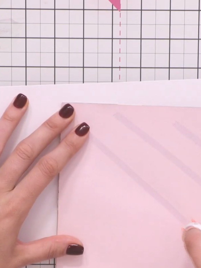 Step 11: Adhere all pages into your album by applying tape along the spine edge of each page. Ensure the pages don't ex
