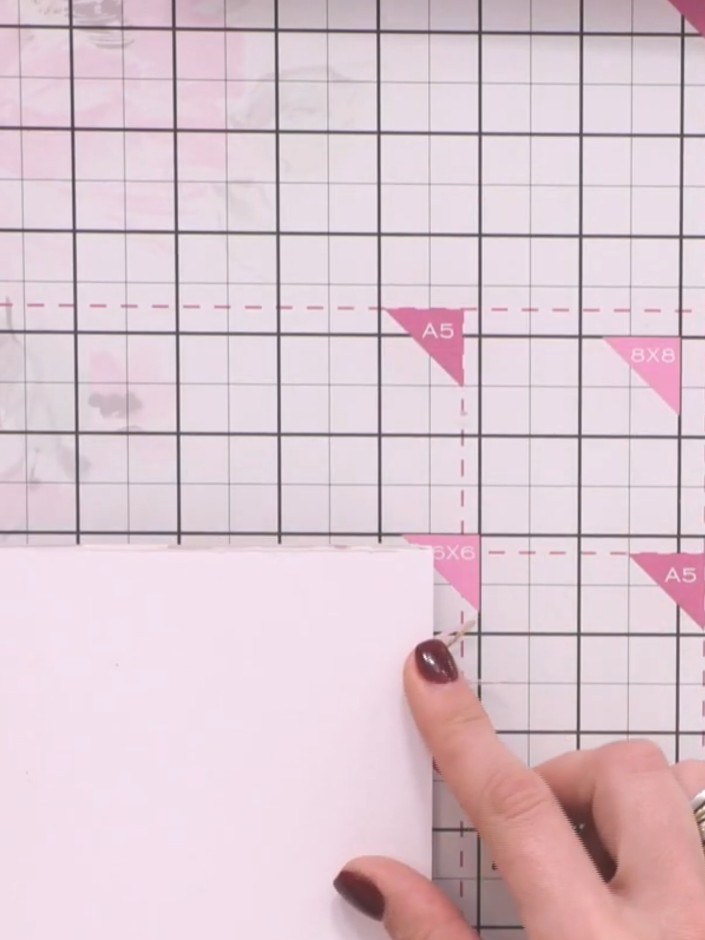 Step 12: Cut patterned paper to fit your front and back covers, leaving a small white border showing around the edges. 