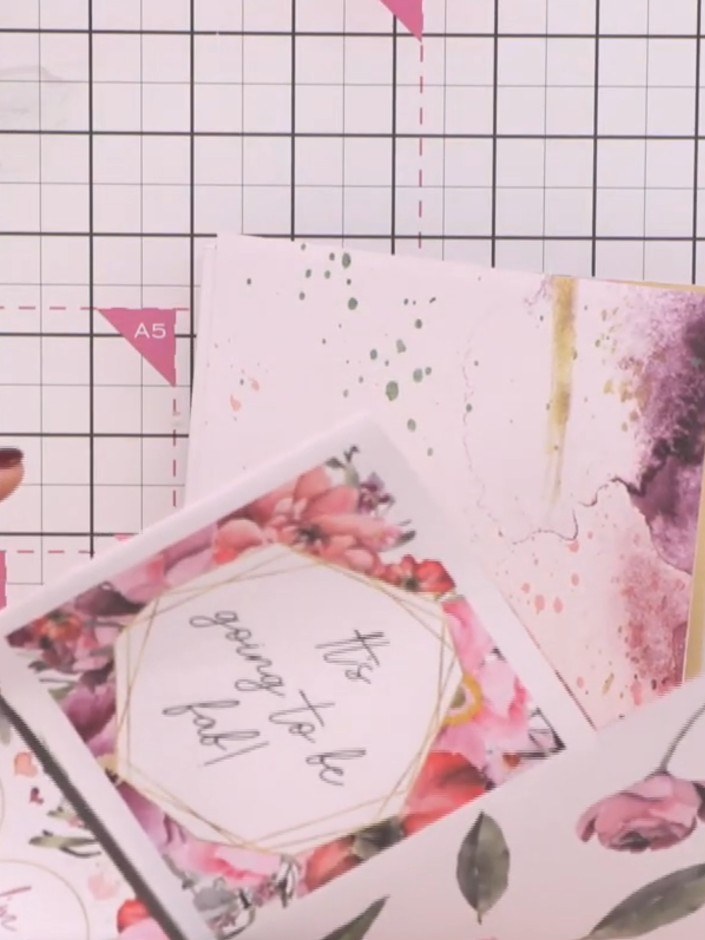 Step 13: Cut out your chosen sentiment or topper from the paper pad. Adhere it to the front cover of your album as the 
