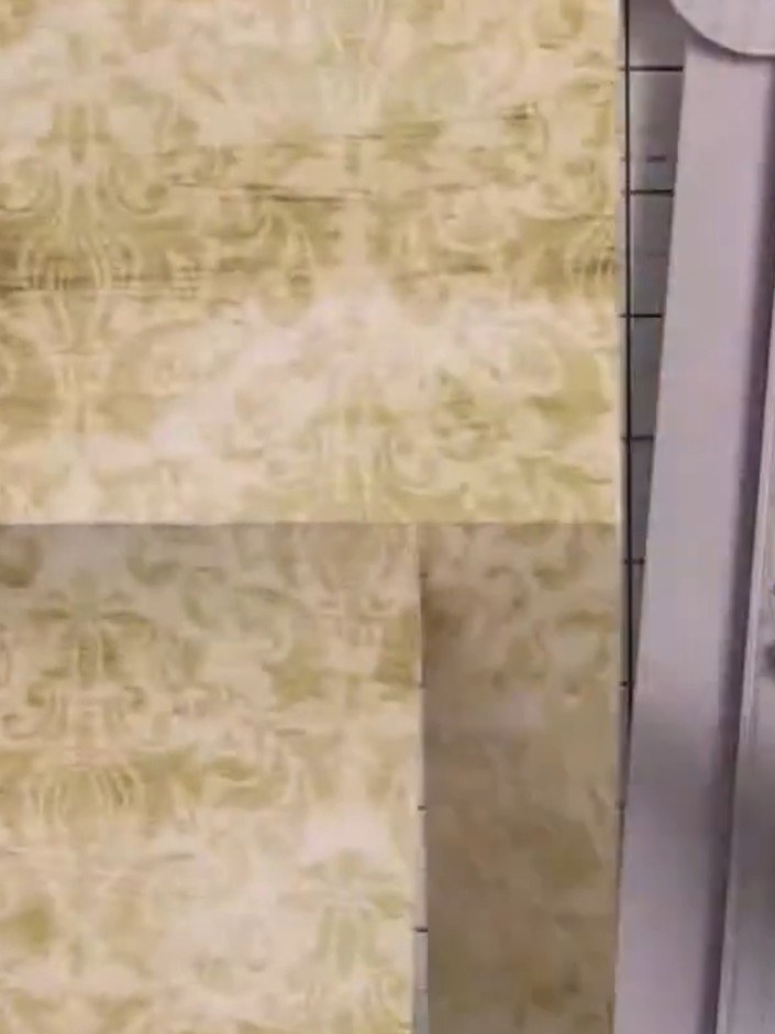 Step 5: Cut along the second score line at 2 inches from the fold. Use your paper trimmer to make a clean, straight cu