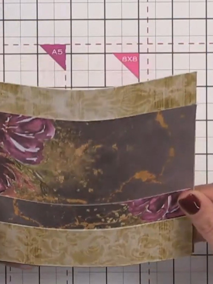Step 9: Optional: Cut thin strips of contrasting patterned paper or cardstock. Attach one strip along the top edge of 