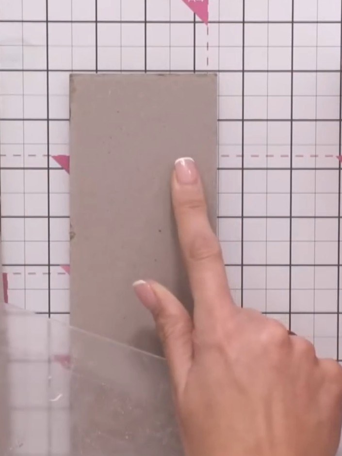 Step 2: Place your kraft cardstock into the embossing folder, positioning it as if you were going to emboss the entire