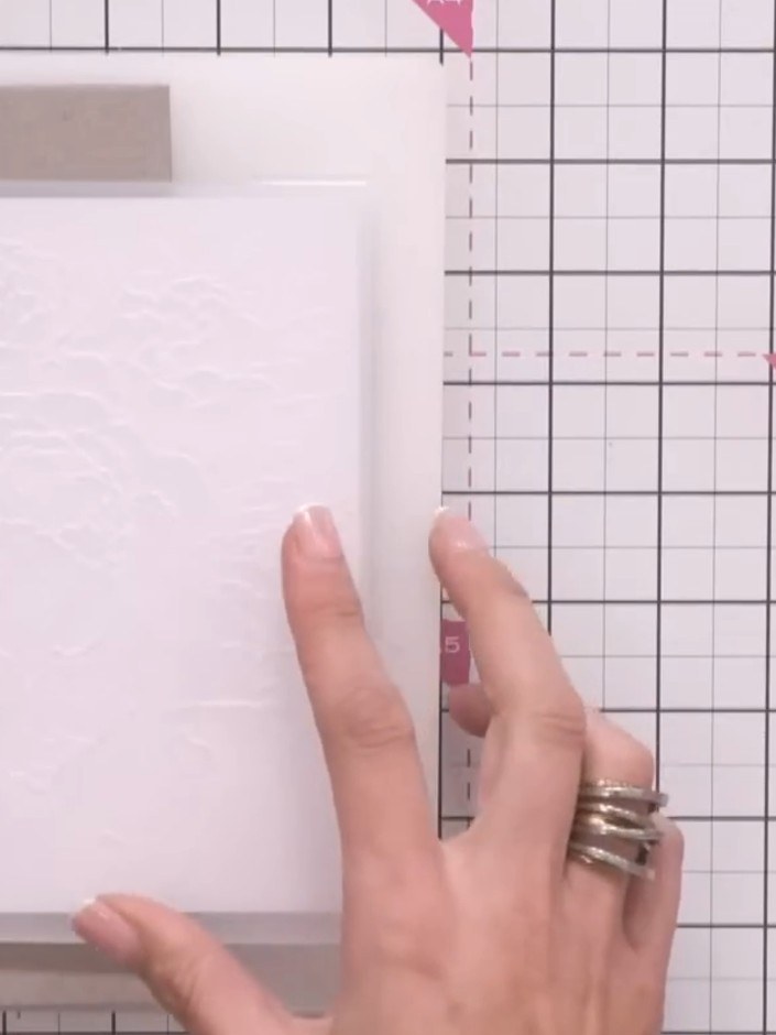 Step 3: Position a piece of mount board (approximately 2mm thick) over the area you want to remain flat on your emboss