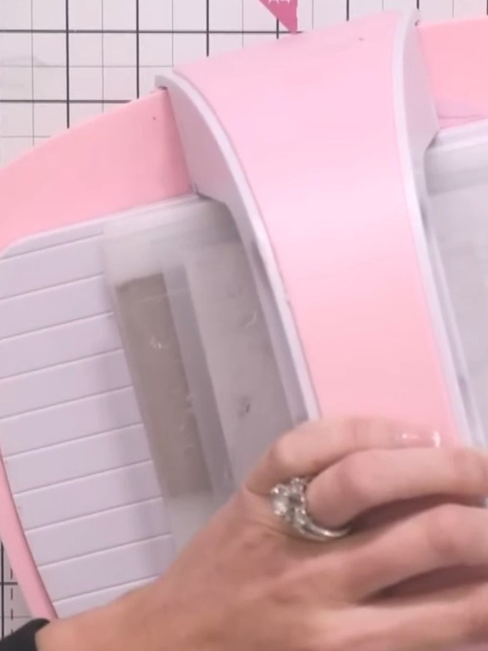 Step 4: Insert the embossing folder containing the cardstock and mount board into your die-cutting machine. Use the th