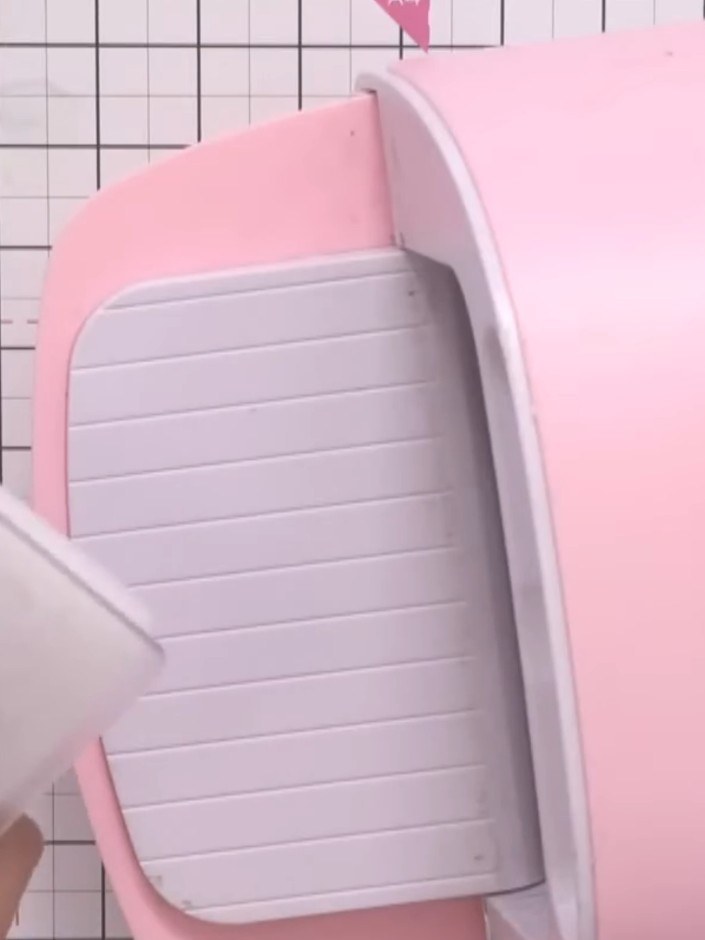 Step 5: Set up your die-cutting machine with the thick white plate as the base. Place your embossing folder on top of 