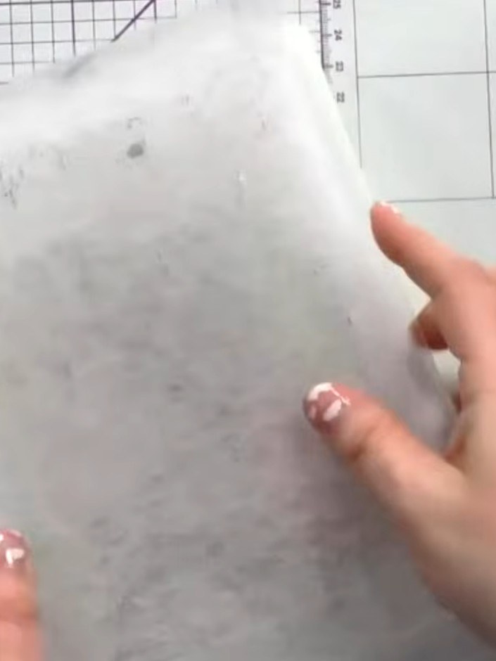 Step 1: Place your white card into the embossing folder. If using coloured card, position it inside the folder ready f
