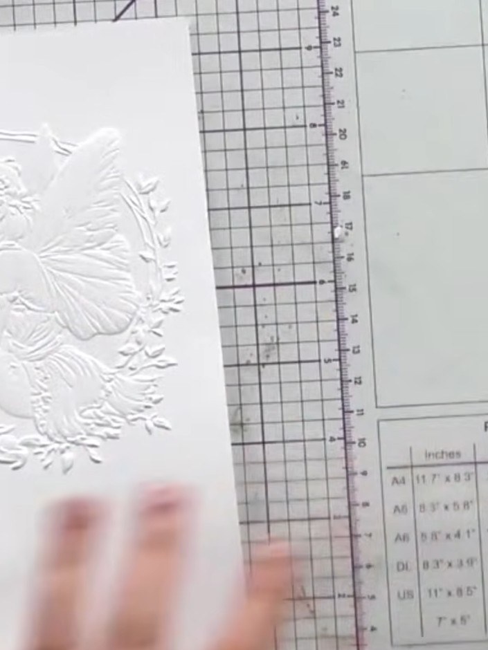 Step 4: Select an ink colour that complements your card design. Place the embossed card into your die-cutting machine 