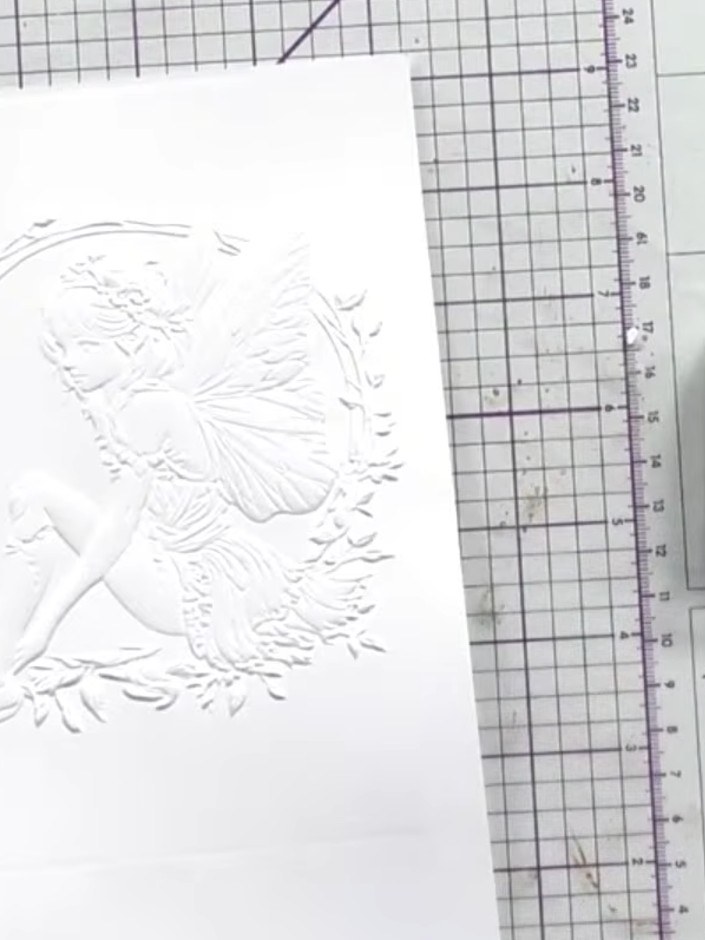Step 5: Using a sponge or dauber, gently rub the Aladine Izink Pigment Metal ink over the raised embossed areas of the