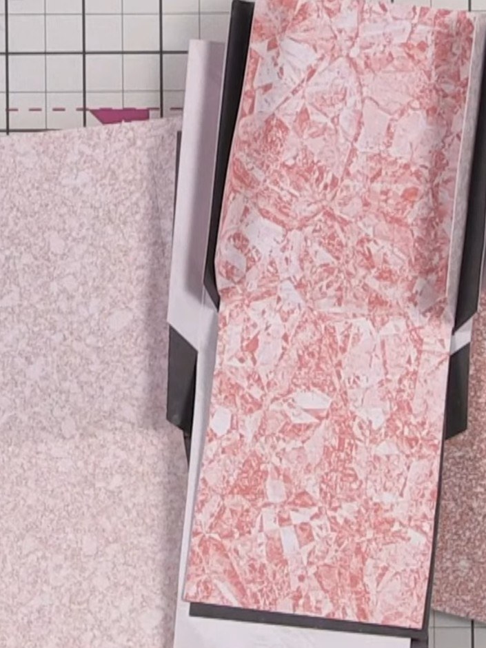 Step 11: Punch a decorative circle in the centre of each pocket using a 1-inch or 2-inch circle punch to create an open