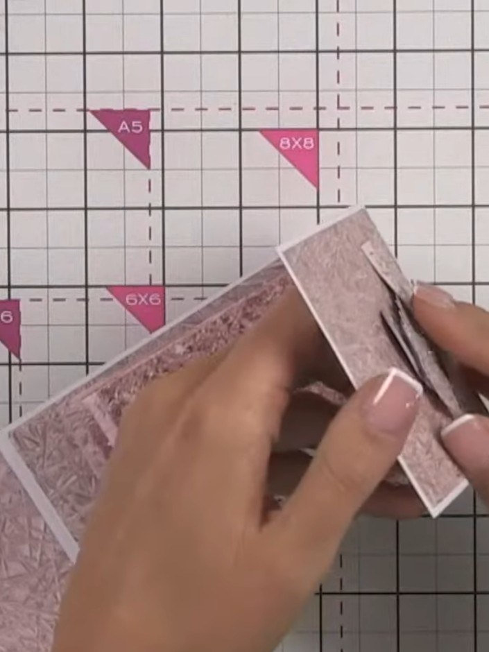 Step 14: Create a closure by punching a circle from white card and one from patterned paper. Glue the patterned circle 