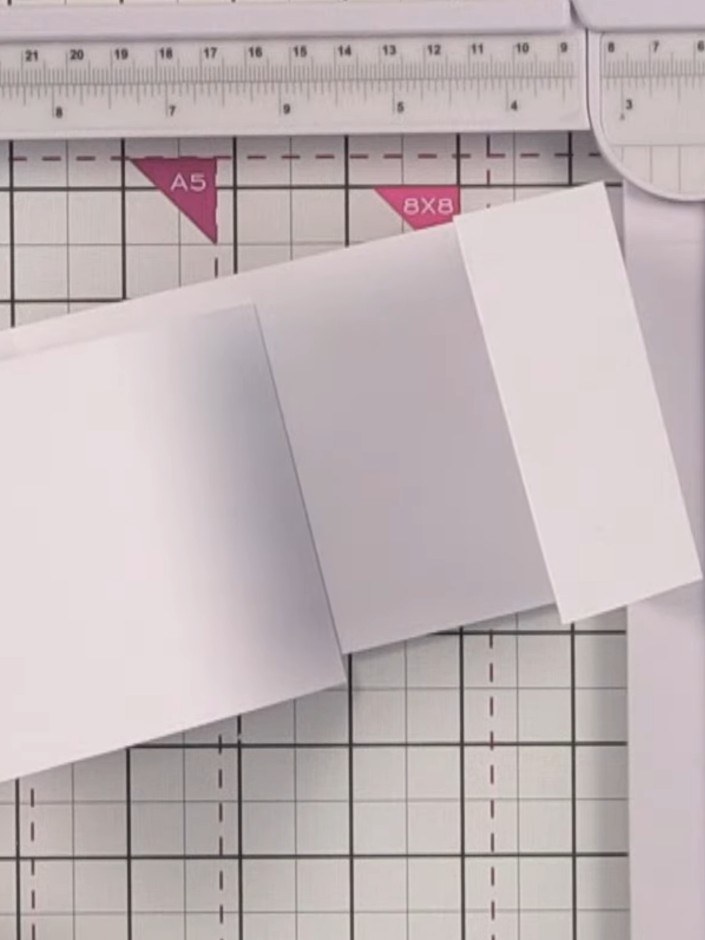 Step 3: Cut a rectangle of white card measuring 4.5 by 3.5 inches from the offcut. Glue this piece to the base of your
