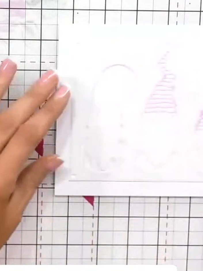 Step 1: Position the first layering stencil (number 1) in the corner of your white card panel, aligning it using the n