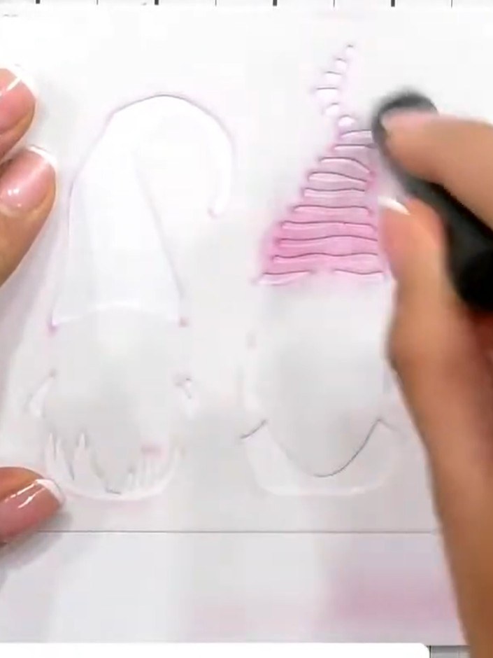 Step 2: Pounce light grey ink through the first stencil layer to create the base shapes of the gnome bodies. Use a ble