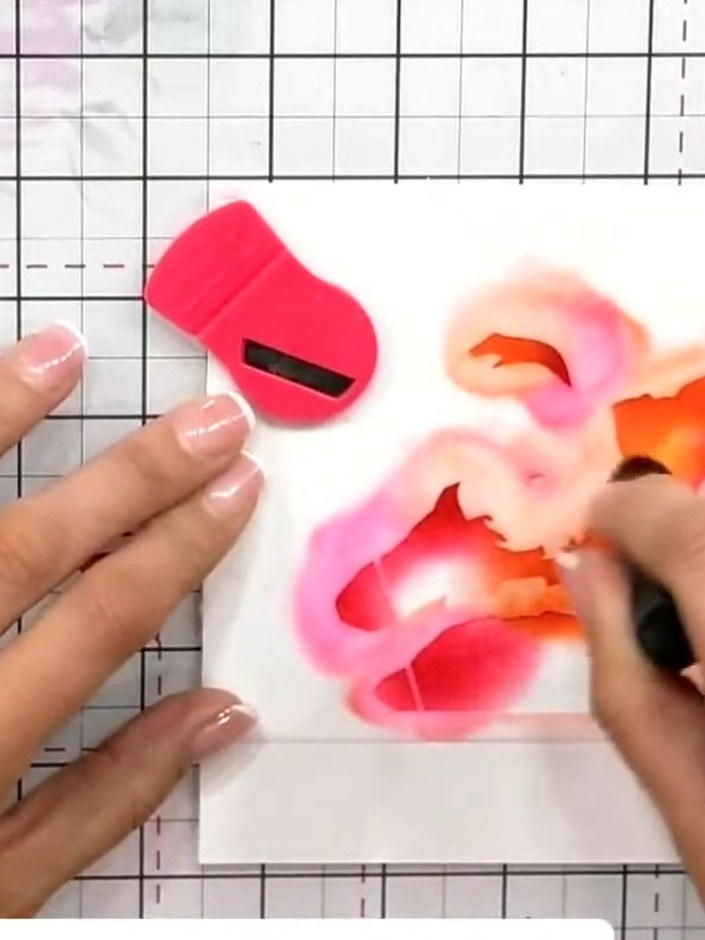 Step 2: Position the second stencil over your card and blend peachy or olive ink through it to add skin tone to Santa'