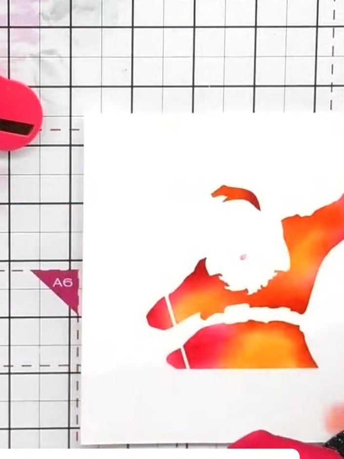 Step 3: Using the second stencil layer, apply yellow ink through the belt area of the Santa design to create a coordin
