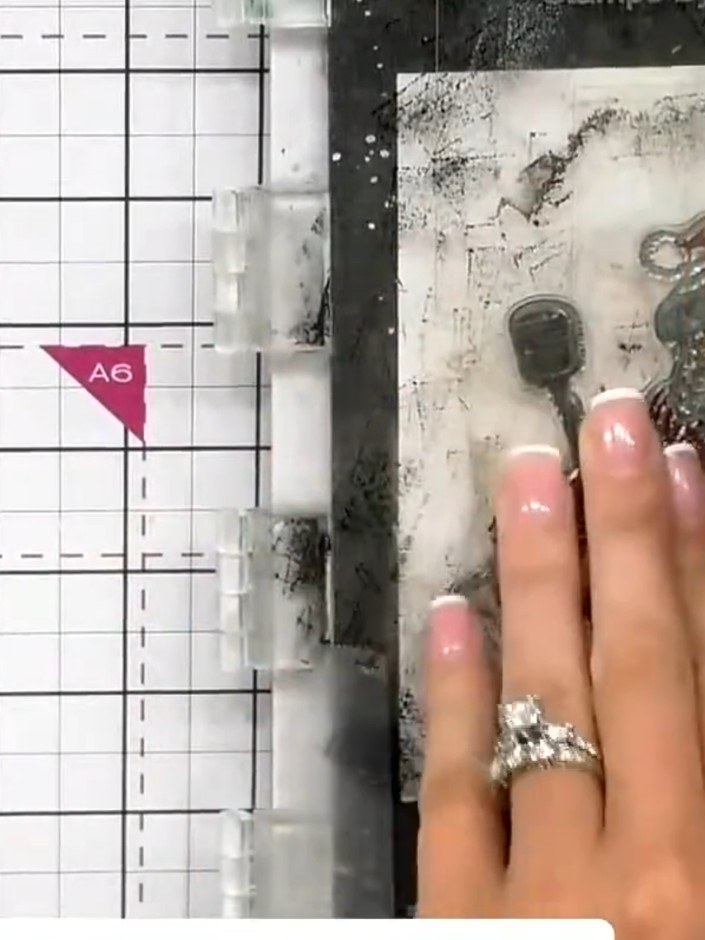 Step 7: Tap the stamped image with an anti-static bag to remove any moisture or oils before applying embossing powder.