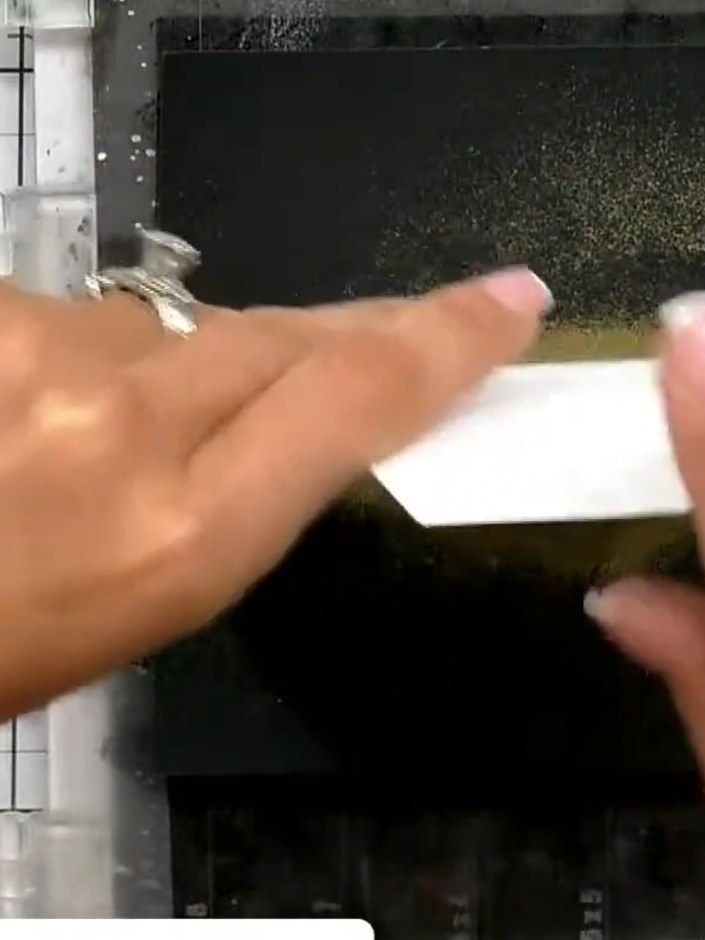 Step 9: Heat the embossing powder with a heat gun, moving steadily across the image until the powder melts and sets to