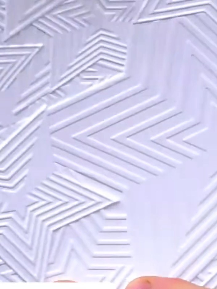 Step 5: Examine both sides of the embossed card to see the dimensional star-upon-stars effect created by the embossing