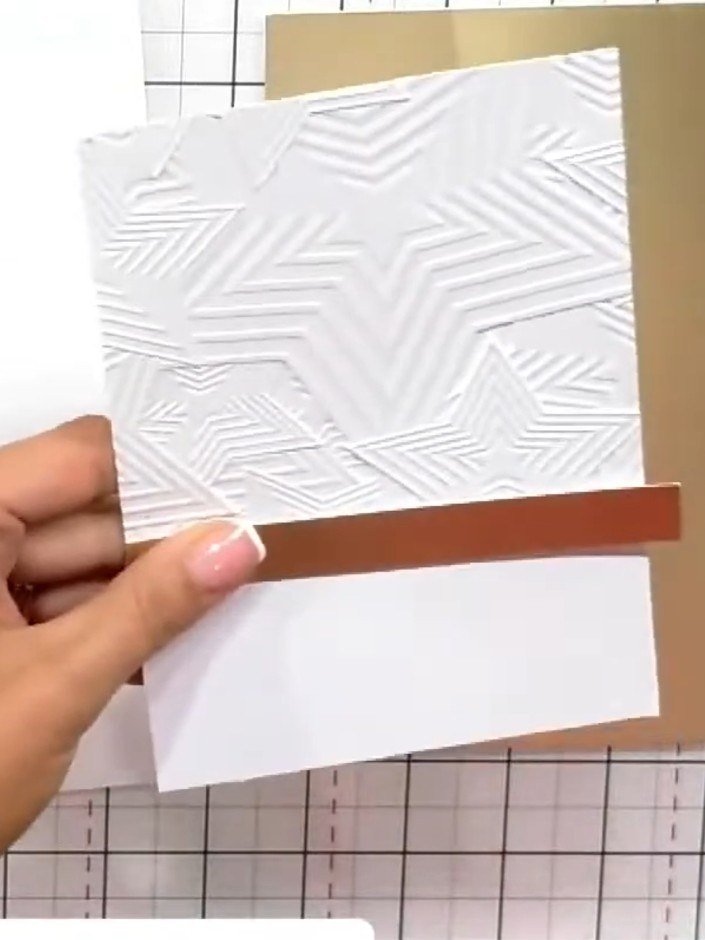 Step 7: Stamp your chosen sentiment in black ink onto the white embossed card panel. Position it towards the bottom of