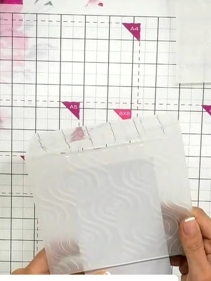 Step 1: Take a slimline card base and position the first embossing folder (the detailed damask textile design) at the 