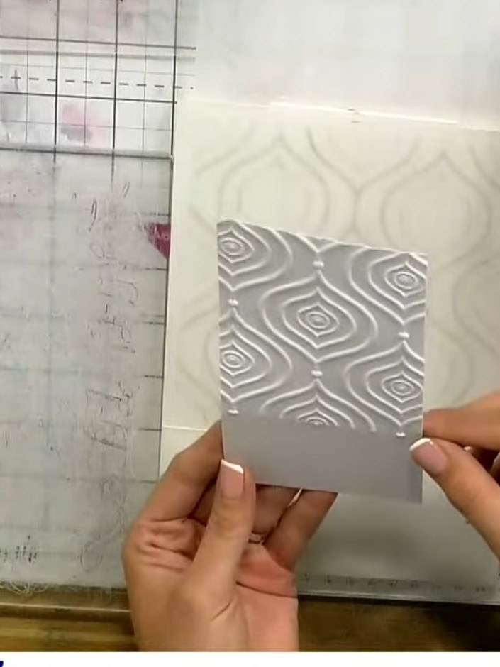 Step 4: Run the lower section of the card through the die-cutting machine with the geometric embossing folder to creat