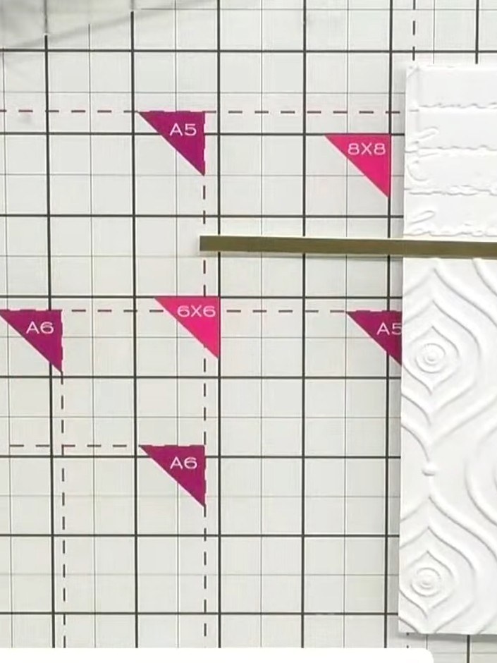 Step 6: Cut a strip of gold satin board to place over the join line between the two embossed sections, creating a deco