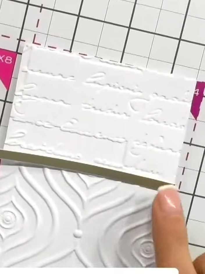 Step 7: Glue the gold strip down the centre of the card to conceal the overlap between the two embossed panels and cre