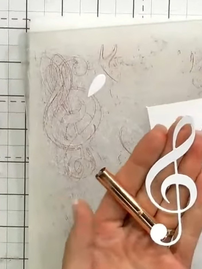 Step 2: Apply brown distress ink over the stamped treble clef using a blending brush to create a woody, vintage effect