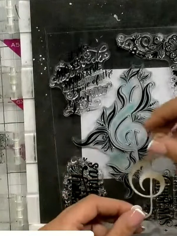 Step 6: Stamp the sentiment 'It's the Most Wonderful Time of the Year' around the treble clef detail, positioning the 
