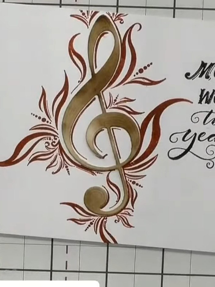 Step 1: Take a white card base and position your completed treble clef and sentiment design on the front. The design f