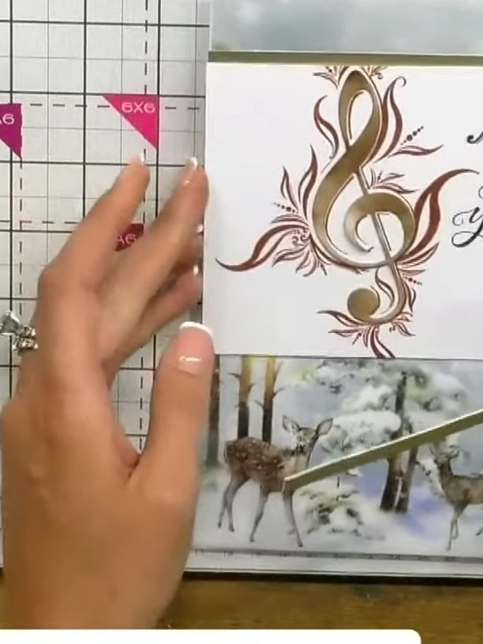 Step 5: Cut two pieces of gold satin board or decorative strip to create borders for your card. Position them to frame