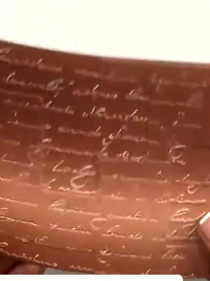 Step 5: Mount the embossed copper panel onto your card front, positioning it to create visual interest with the script