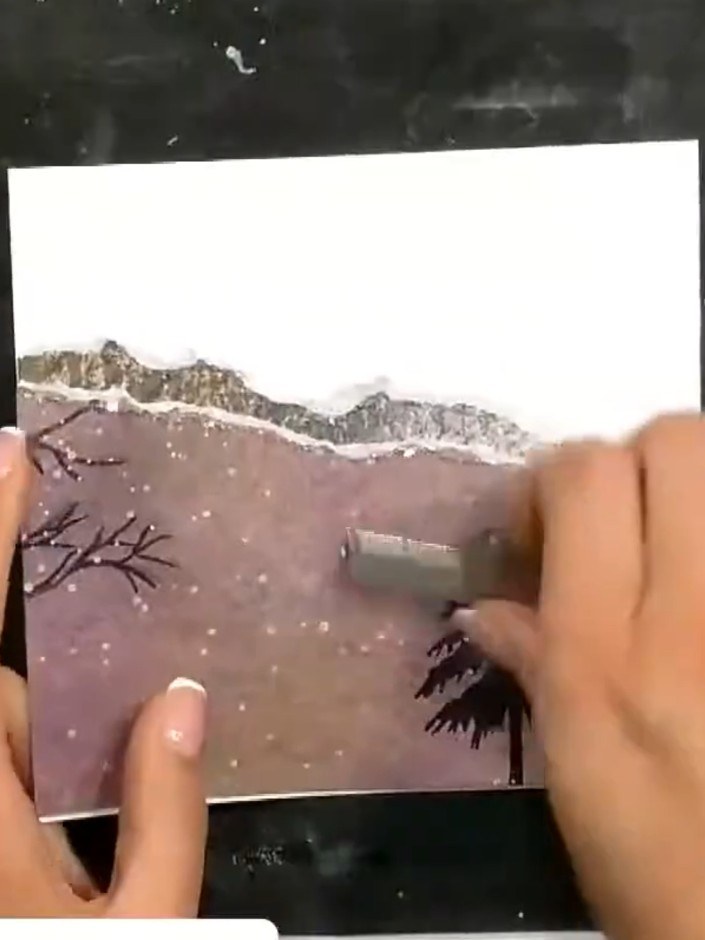 Step 8: Mount the stamped stag and antlers piece onto the card front, positioning it over the landscape scene to compl