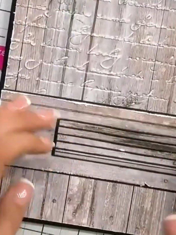Step 2: Position the gold treble clef embellishment on the lower left area of the card panel to check placement before