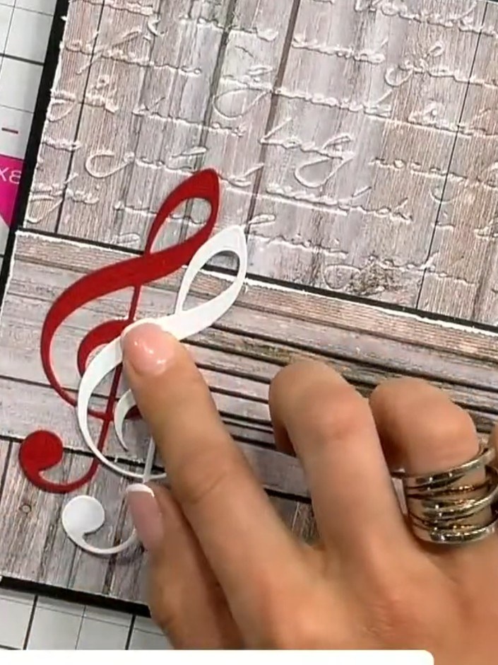 Step 3: Die cut individual musical notes from red, white and gold cardstock using the treble clef and music note dies 