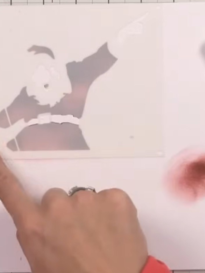 Step 3: Remove the first stencil and position stencil number two over the image, aligning it carefully. This stencil s