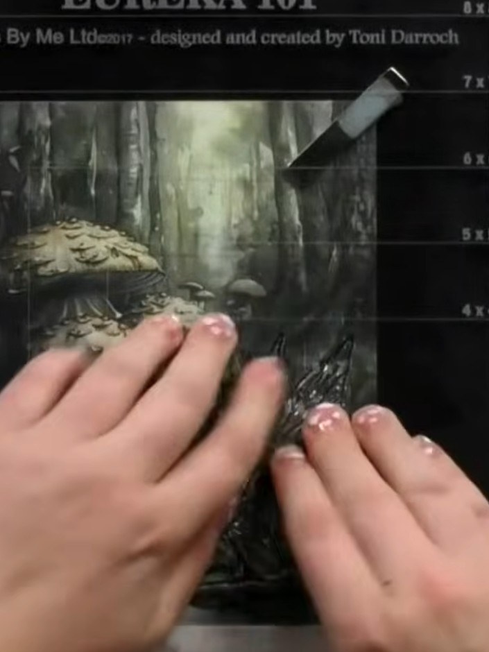 Step 5: Select watercolour pencils in colours that complement your mystical forest design. Choose darker tones to add 